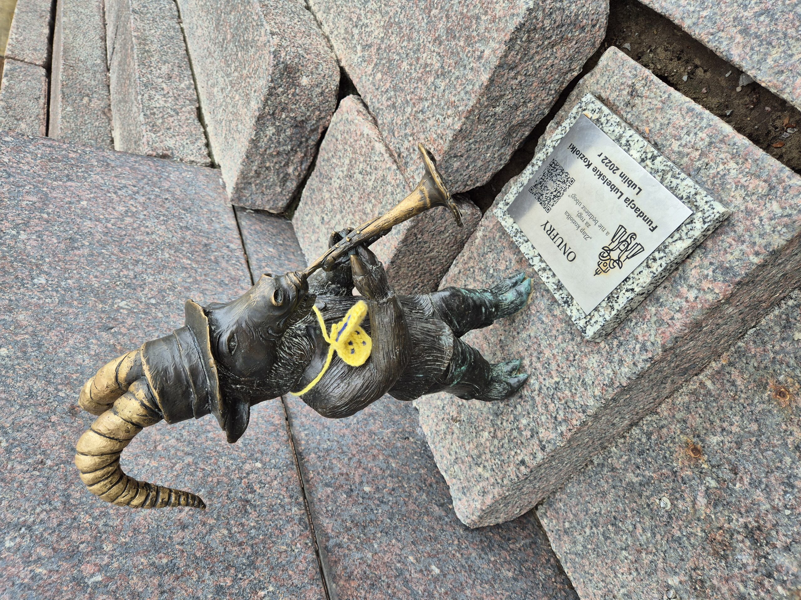 Small Goat statue in Lublin playing a trumpet